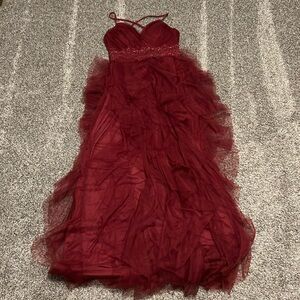 Maroon ruffle split leg prom dress.